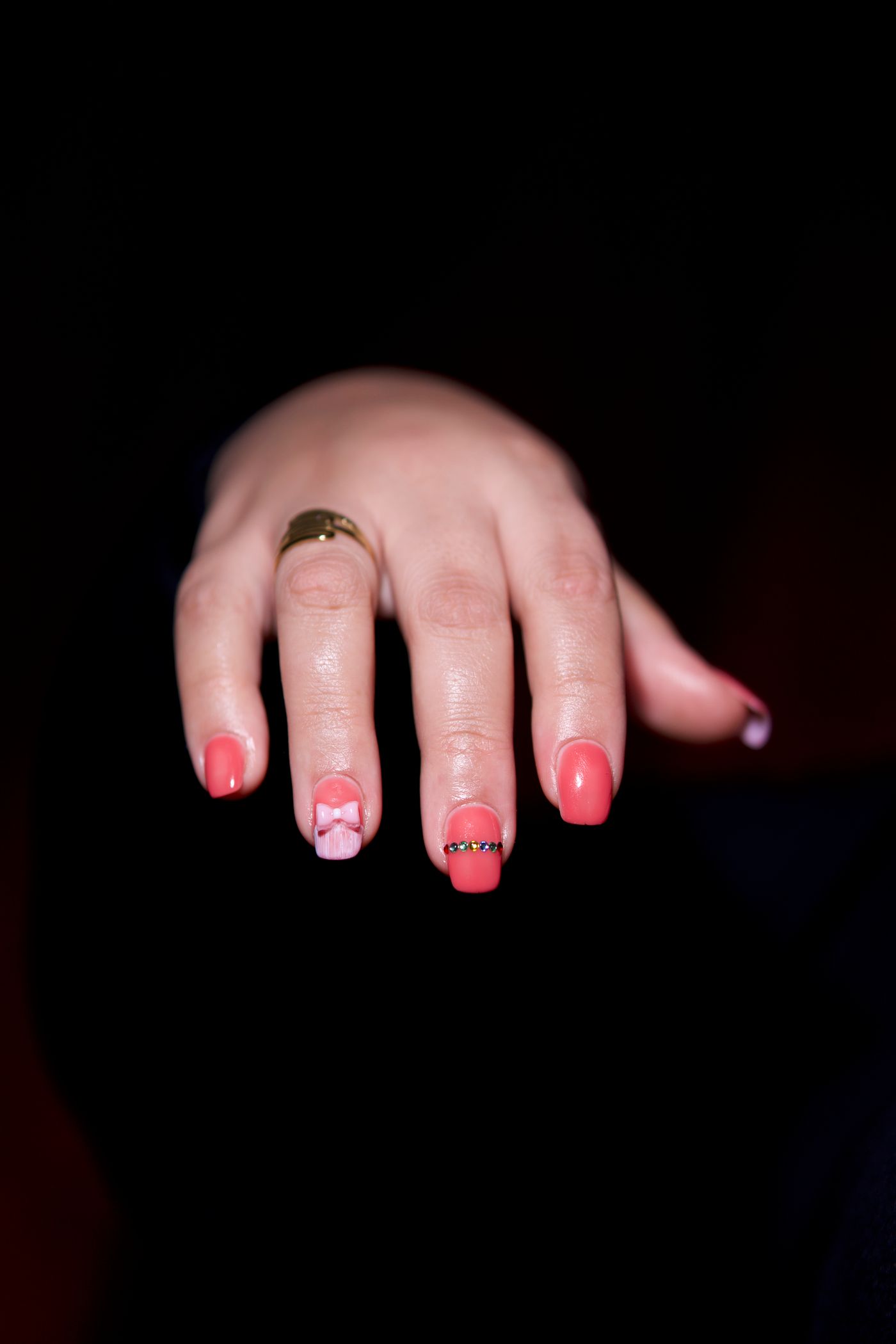 Intricate pink nail art set from an Atlanta studio