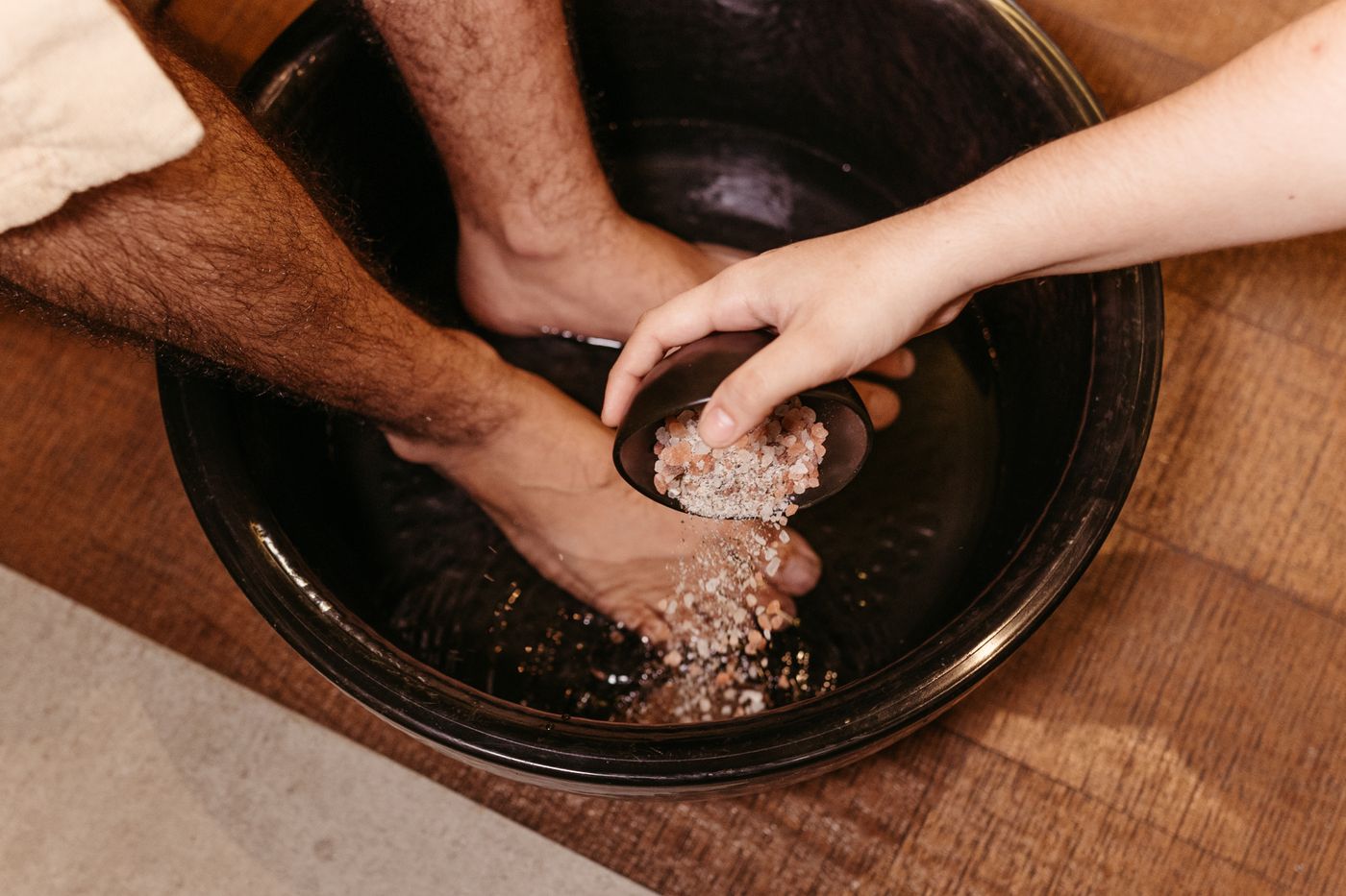 Mineral salt foot soak in a clean basin